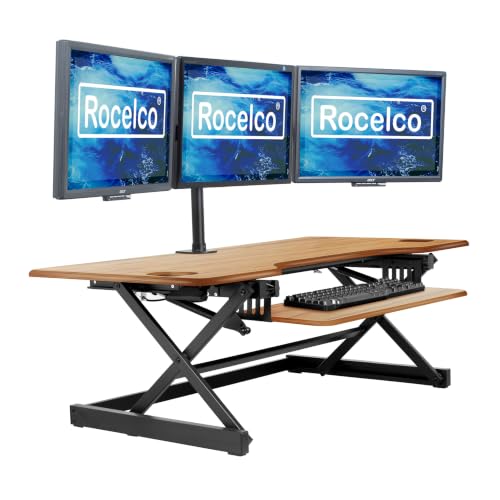 Rocelco 46" Large Height Adjustable Standing Desk Converter - Quick Sit Stand Up Triple Monitor Riser - Gas Spring Computer Workstation - Retractable Keyboard Tray - Teak Wood Grain (R DADRT-46) - color: Teak/Black, size: 46", style: Riser Only